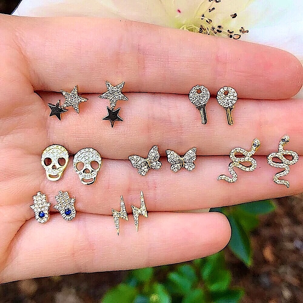 Gold crystal skull snake earring set (7 pairs)
